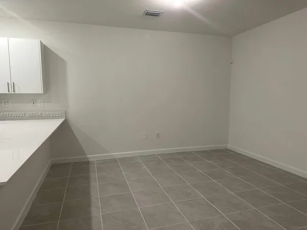 an empty room with a bathroom