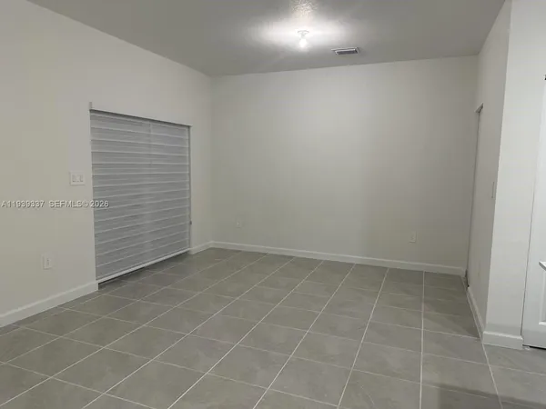 a white toilet sitting next to a shower