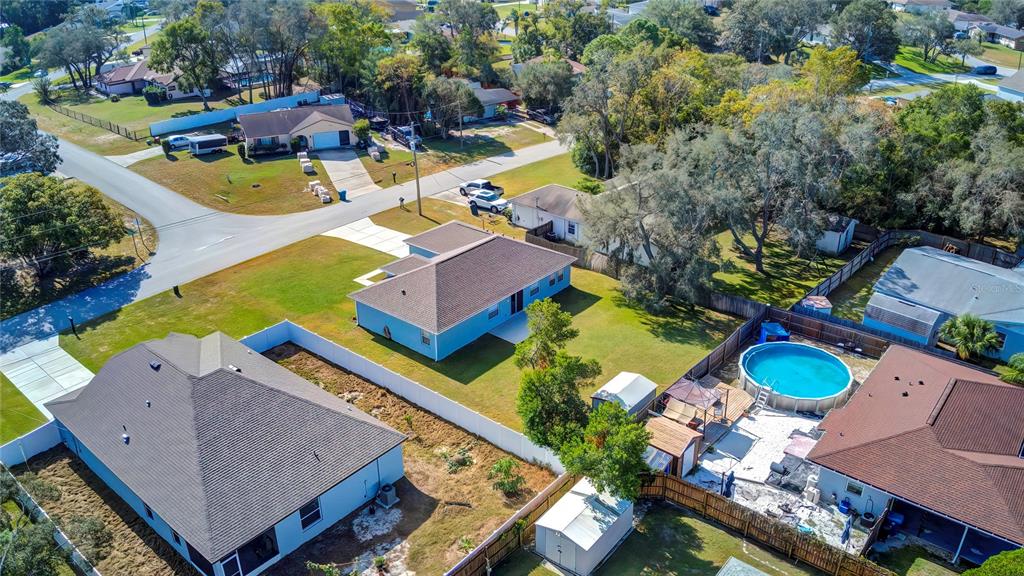 7325 Millstone Street Spring Hill, FL 34606 - Photo 15 of 46 Drone Side and Rear View