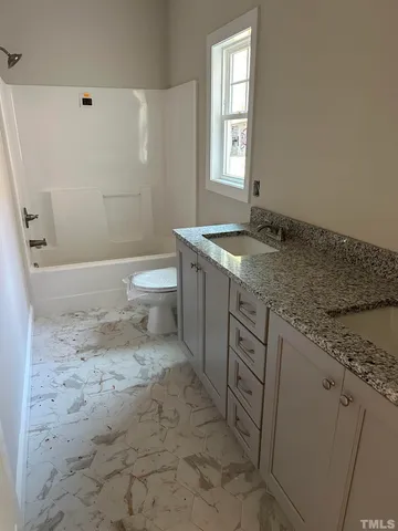 a view of a porch with wooden floor
