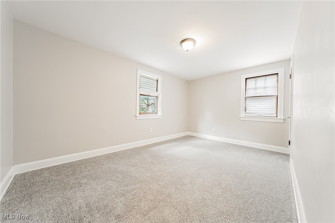 1271 Winston Road Cleveland, OH 44121 - Photo 24 of 43 Empty room featuring carpet floors and baseboards