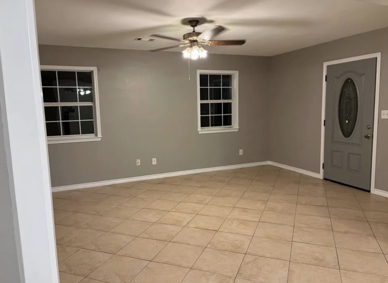 14529 Chapperal Pipeline Road, Unit A Conroe, TX 77302 - Photo 5 of 25 a view of a livingroom with a ceiling fan and window