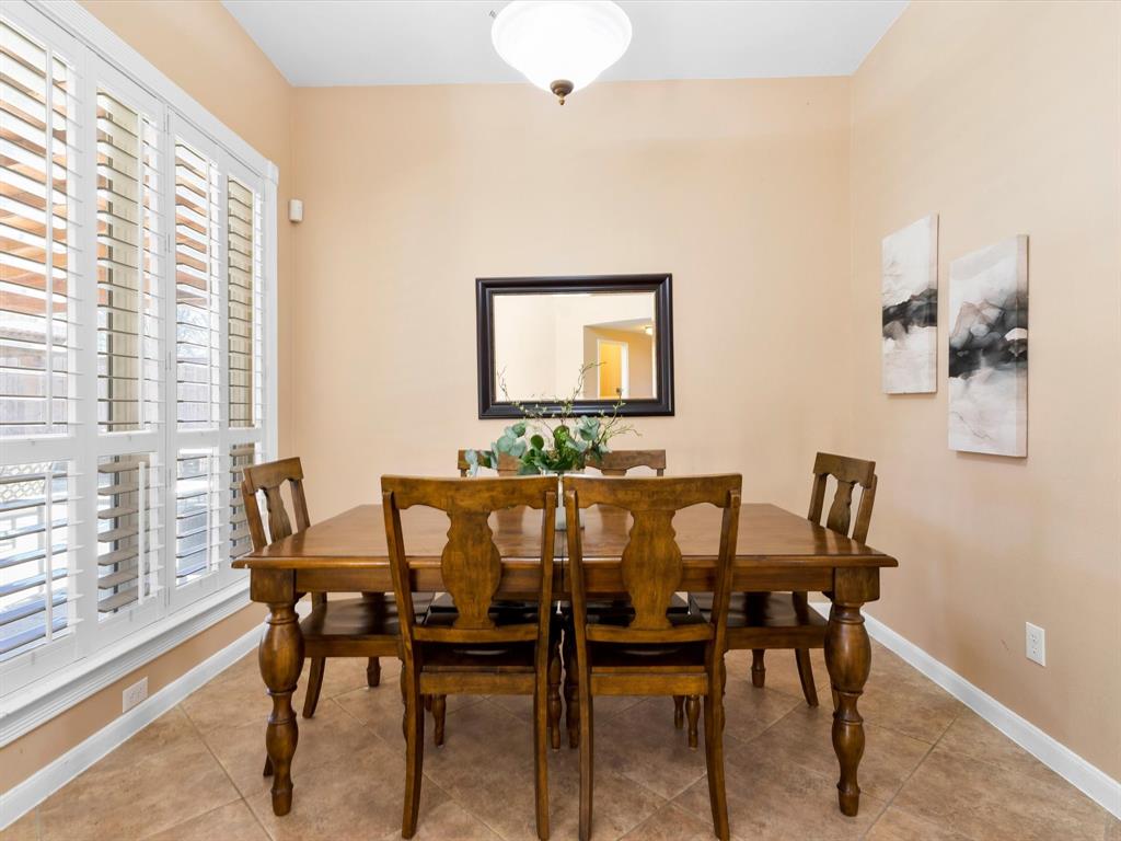 728 Morningside Trail Murphy, TX 75094 - Photo 12 of 40 a view of a dining room with furniture and a window