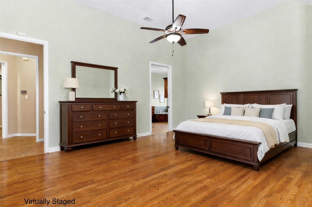 728 Morningside Trail Murphy, TX 75094 - Photo 15 of 40 a bedroom with a bed and a dresser