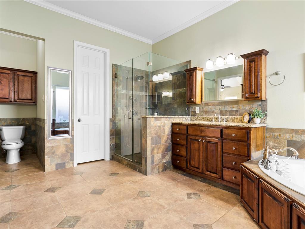 728 Morningside Trail Murphy, TX 75094 - Photo 18 of 40 a spacious bathroom with a granite countertop sink mirror and shower
