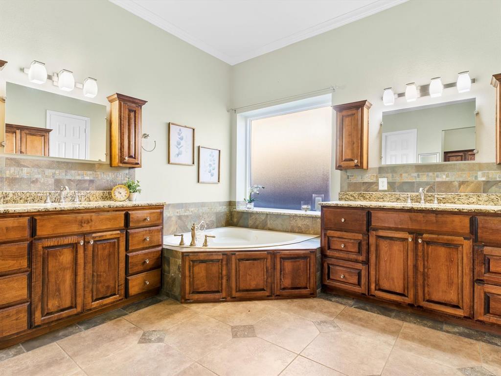728 Morningside Trail Murphy, TX 75094 - Photo 19 of 40 a spacious bathroom with a granite countertop tub sink double and mirror