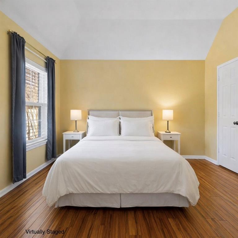 728 Morningside Trail Murphy, TX 75094 - Photo 21 of 40 a bedroom with a bed and wooden floor