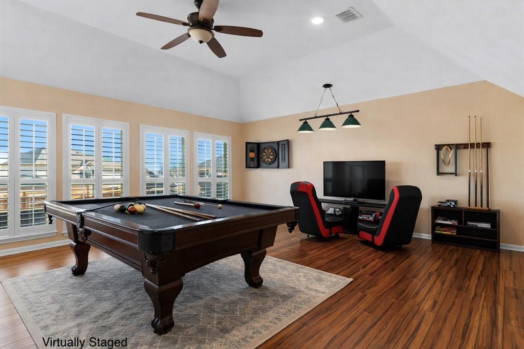 728 Morningside Trail Murphy, TX 75094 - Photo 24 of 40 a living room with furniture a flat screen tv and a wooden floor