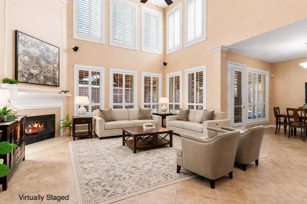 728 Morningside Trail Murphy, TX 75094 - Photo 3 of 40 a living room with furniture large window and fireplace