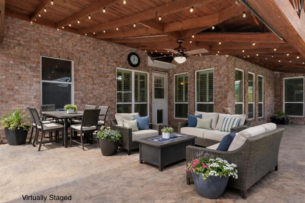 728 Morningside Trail Murphy, TX 75094 - Photo 4 of 40 a living room with furniture potted plant and a large window