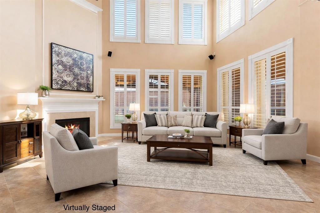728 Morningside Trail Murphy, TX 75094 - Photo 7 of 40 a living room with furniture and a fireplace
