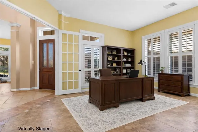 a kitchen with stainless steel appliances a stove a sink a refrigerator a center island and a cabinets