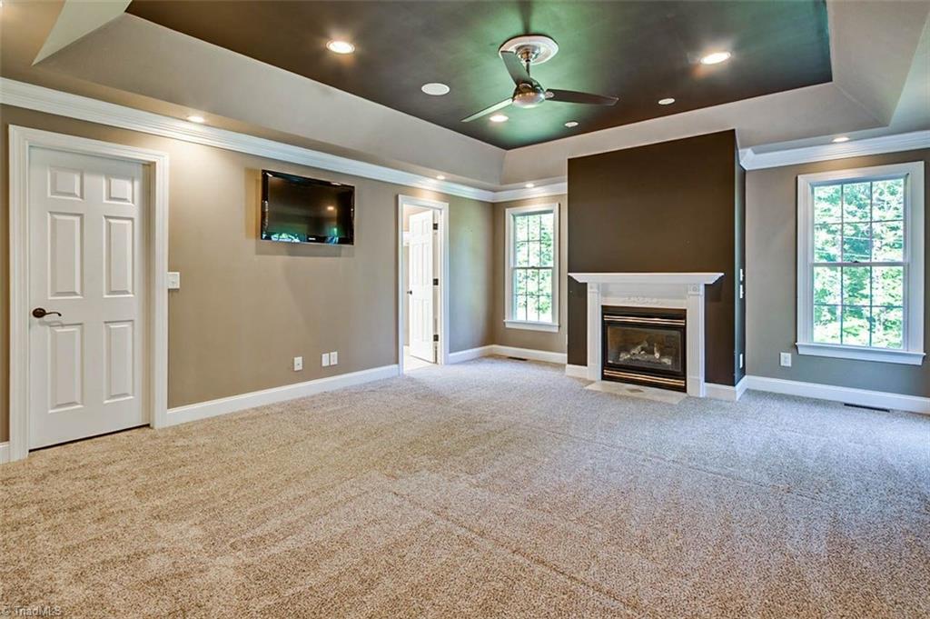 3458 Lassiter Mill Road Asheboro, NC 27205 - Photo 15 of 27 Master bedroom. Check out the ceilings and the fireplace!