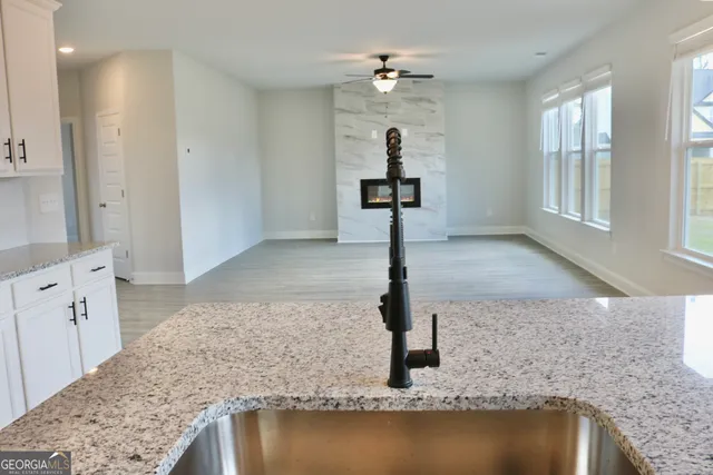 a view of kitchen with wooden floor