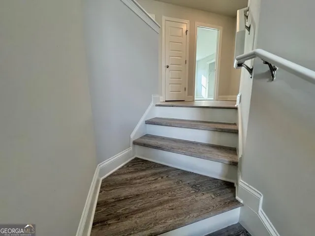 a view of a hallway view with staircase