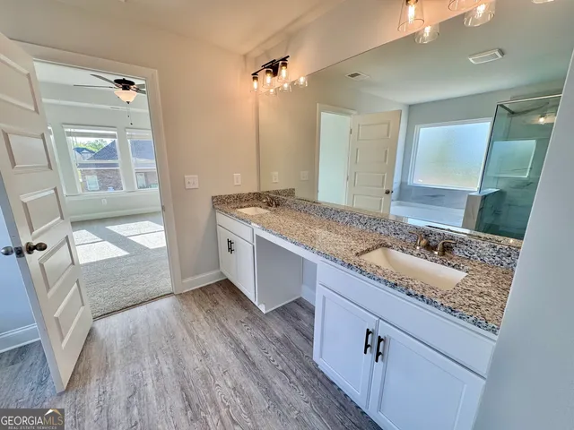 a bathroom with a shower and toilet