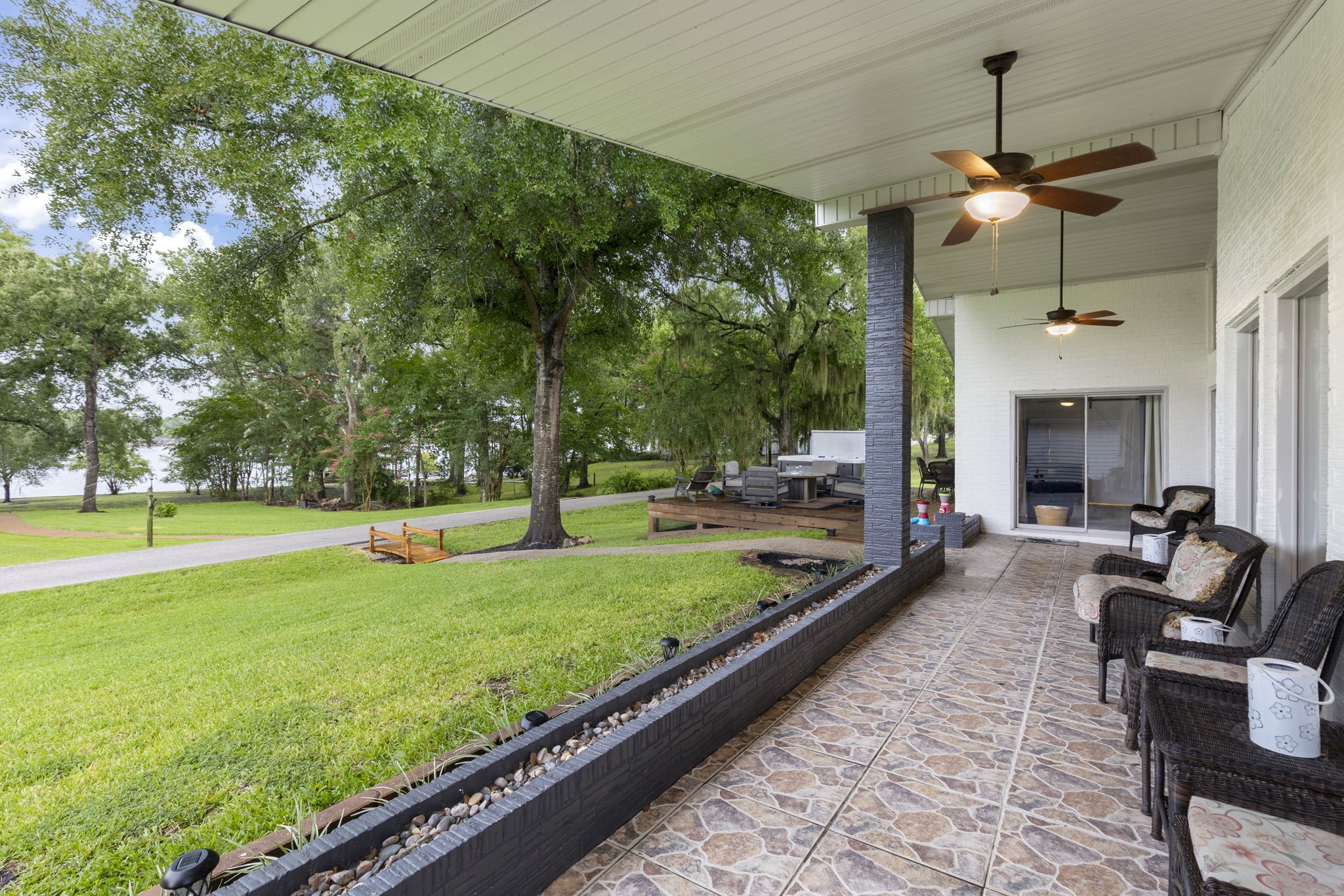 245 Lakeland Road Huntsville, TX 77320 - Photo 40 of 49 From the covered patio, enjoy a breathtaking lake view that offers serenity and natural beauty.