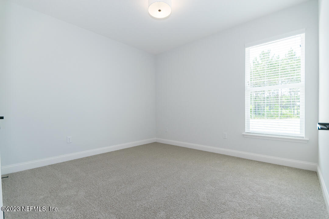 526 Eagle Moon Lake Drive St. Augustine, FL 32092 - Photo 16 of 24 an empty room with a window