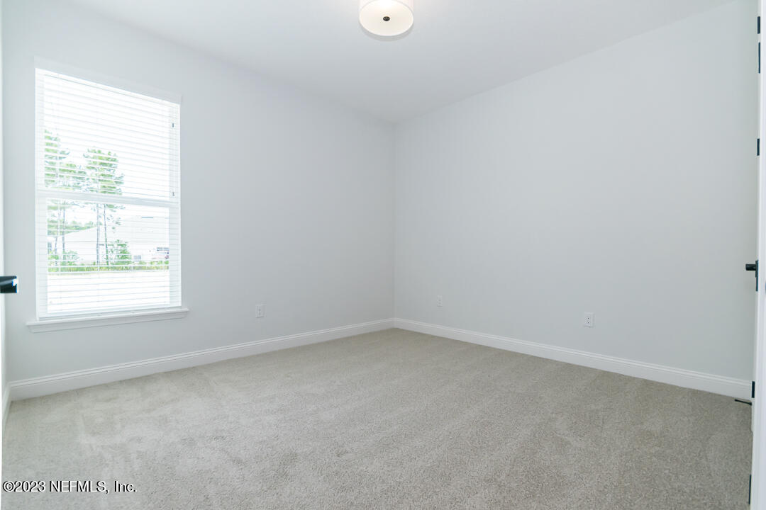 526 Eagle Moon Lake Drive St. Augustine, FL 32092 - Photo 17 of 24 an empty room with a window