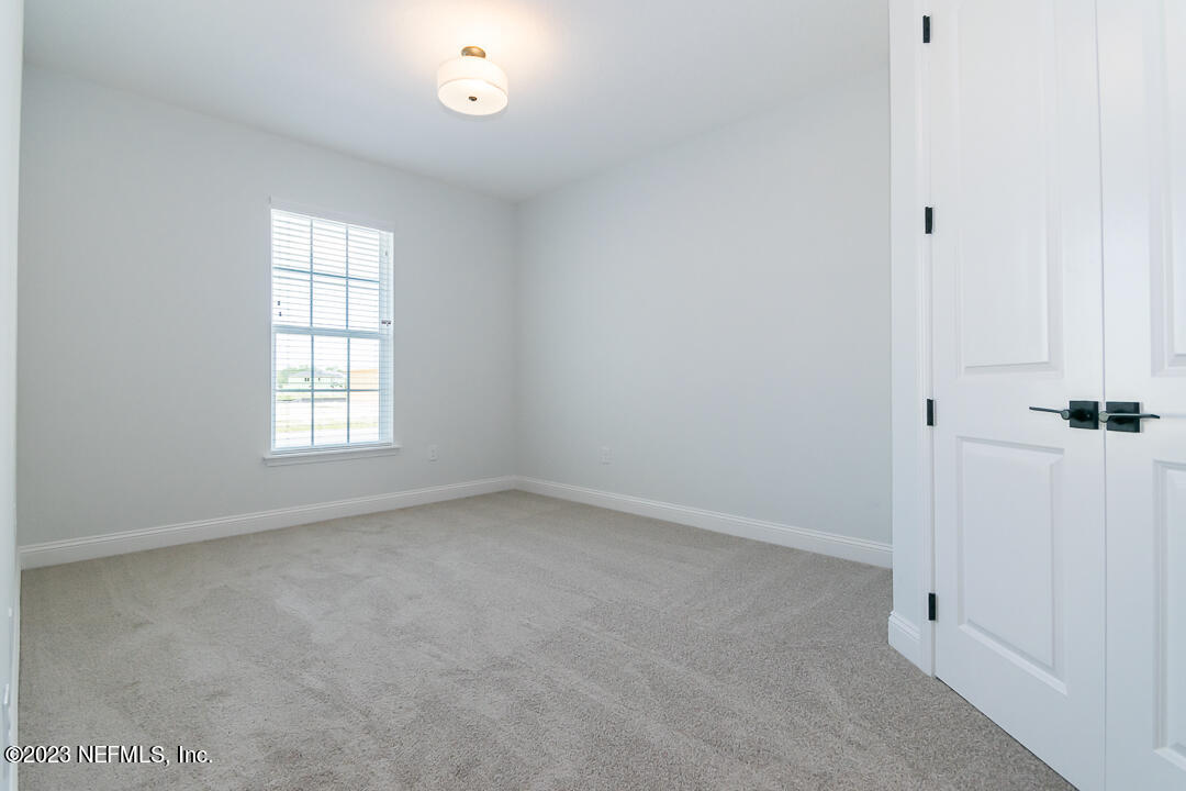 526 Eagle Moon Lake Drive St. Augustine, FL 32092 - Photo 20 of 24 an empty room with a window
