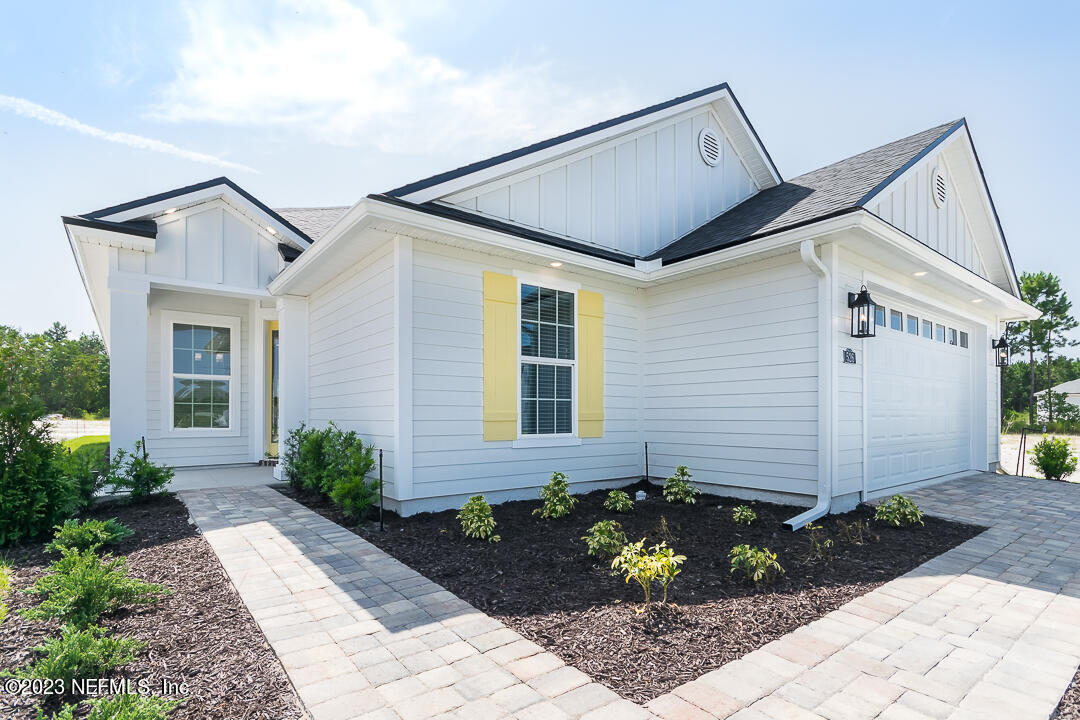 526 Eagle Moon Lake Drive St. Augustine, FL 32092 - Photo 2 of 24 a front view of a house with garden