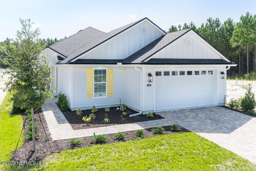 526 Eagle Moon Lake Drive St. Augustine, FL 32092 - Photo 3 of 24 a front view of a house with a yard