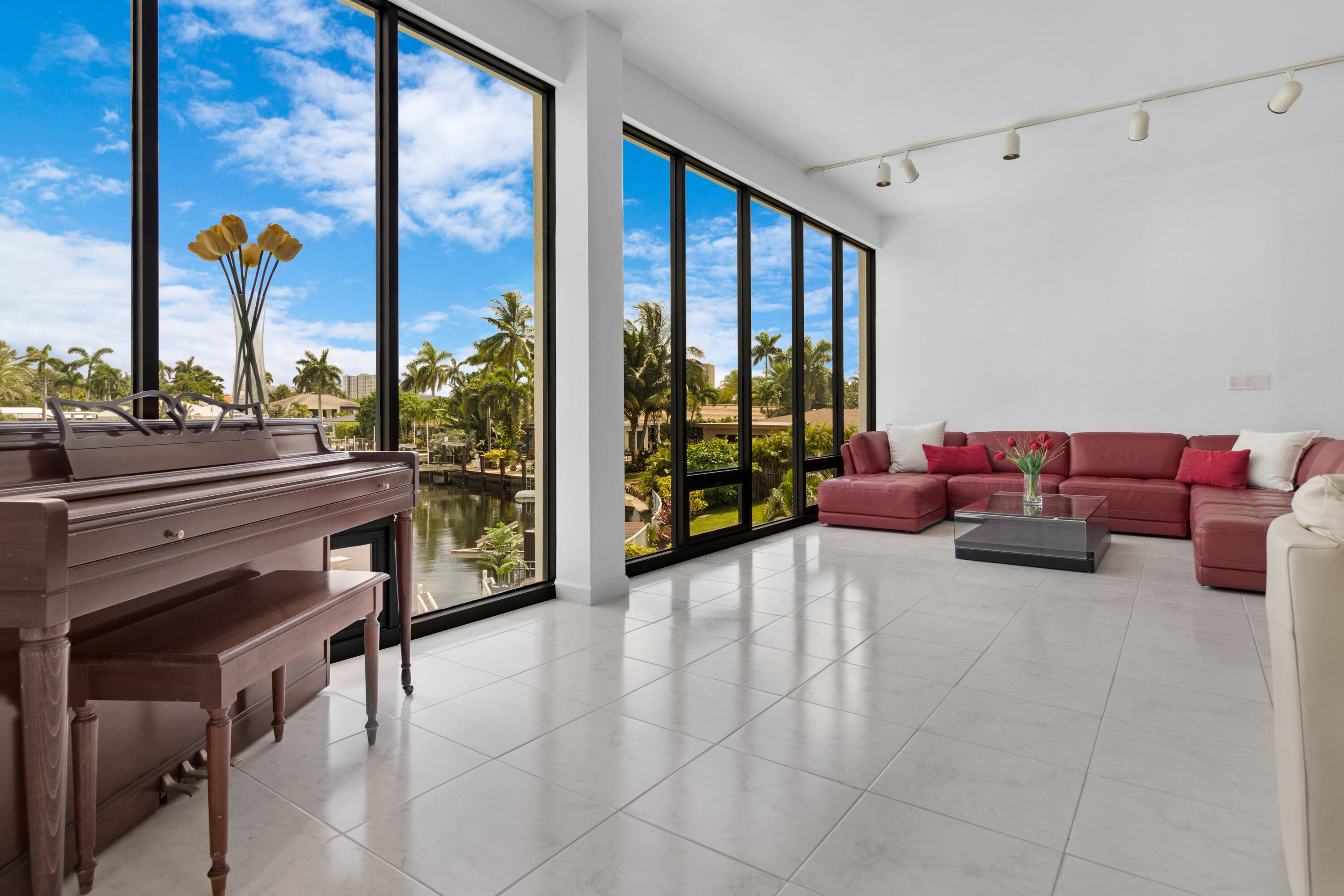 2549 Southeast 9th Street Pompano Beach, FL 33062 - Photo 15 of 73 a living room with furniture and a floor to ceiling window