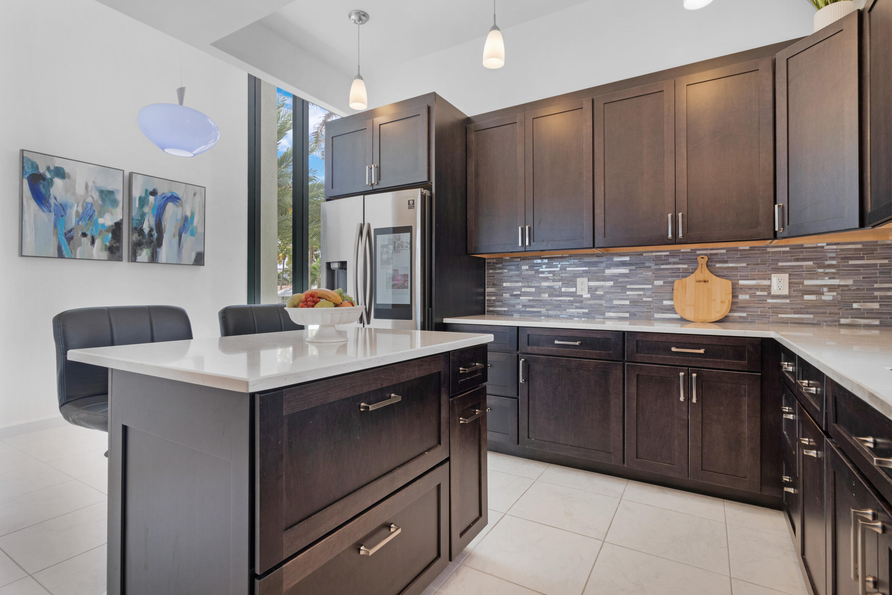 2549 Southeast 9th Street Pompano Beach, FL 33062 - Photo 19 of 73 a kitchen with a sink and a refrigerator