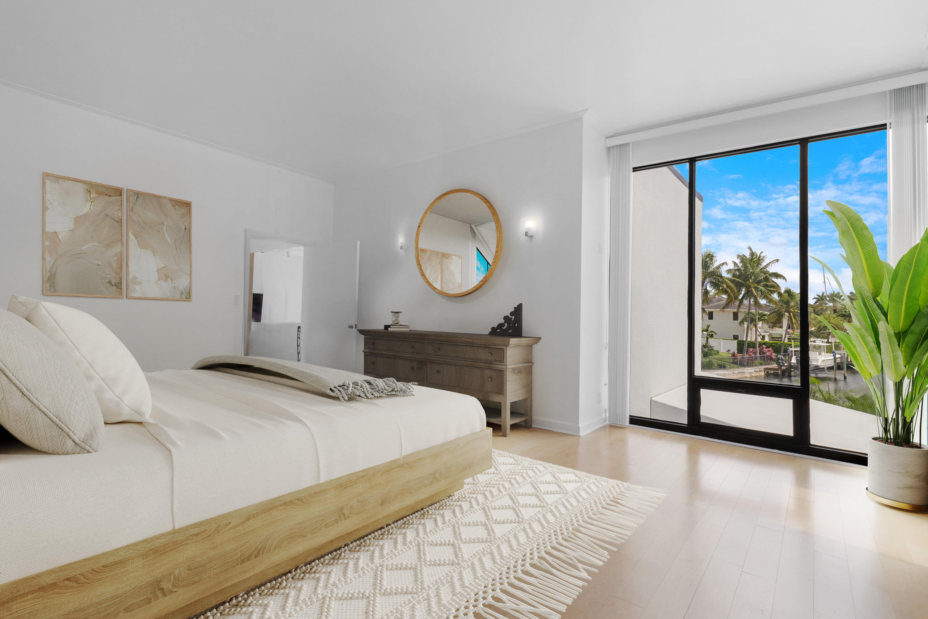 2549 Southeast 9th Street Pompano Beach, FL 33062 - Photo 27 of 73 a bedroom with a bed and a large window with outer view