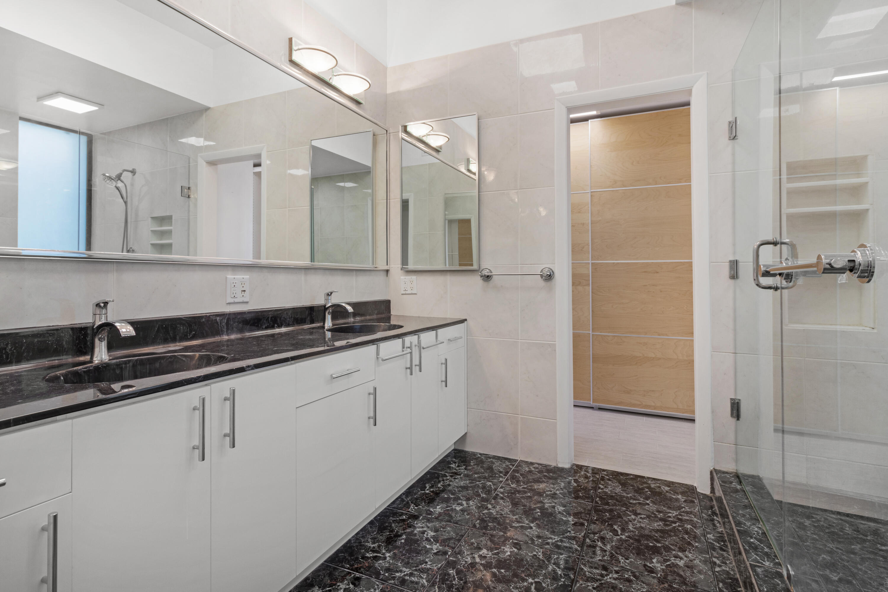 2549 Southeast 9th Street Pompano Beach, FL 33062 - Photo 28 of 73 a bathroom with a sink and a mirror