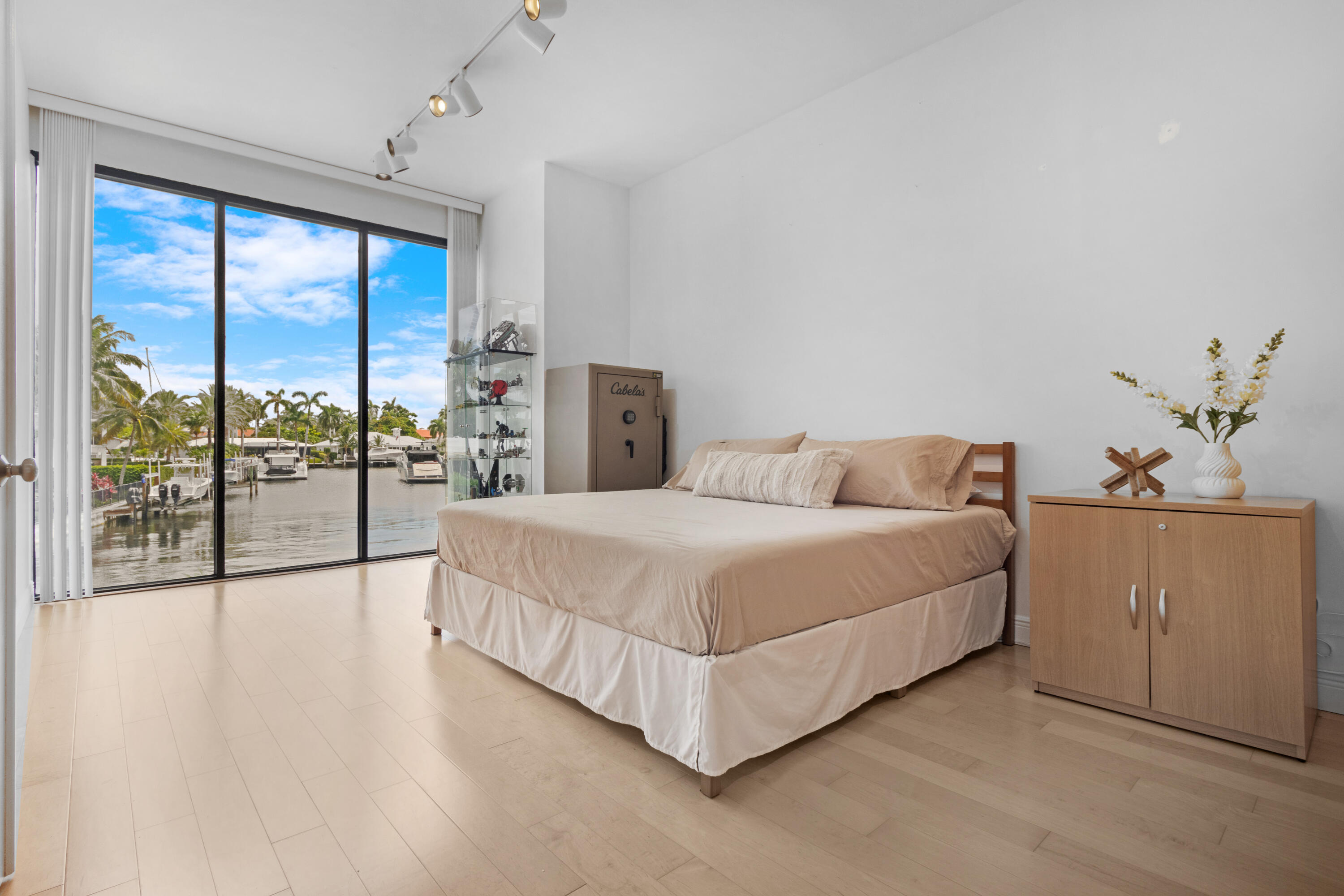 2549 Southeast 9th Street Pompano Beach, FL 33062 - Photo 33 of 73 a spacious bedroom with a large bed and a large window