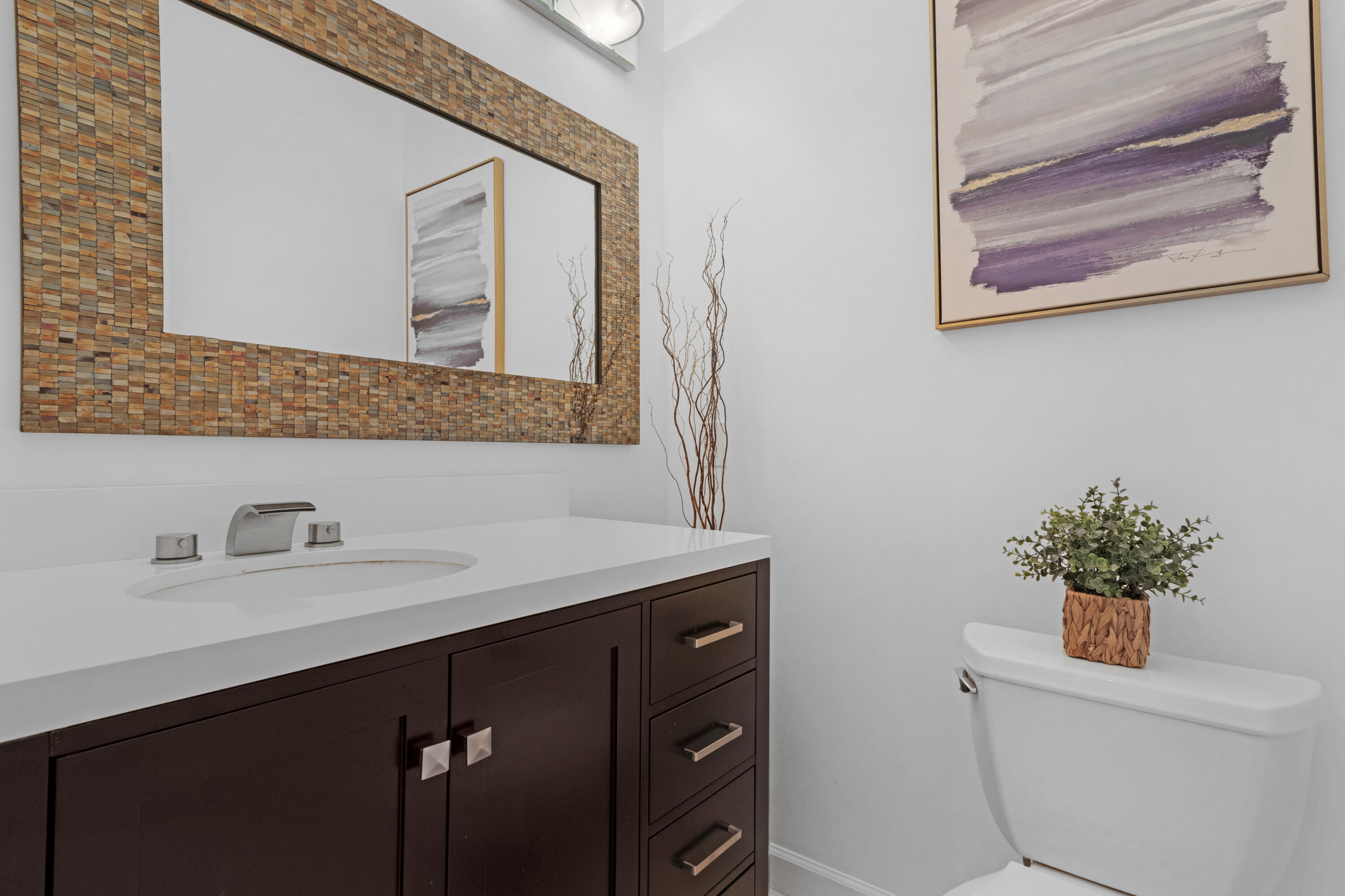 2549 Southeast 9th Street Pompano Beach, FL 33062 - Photo 37 of 73 a bathroom with a sink a vanity and a mirror