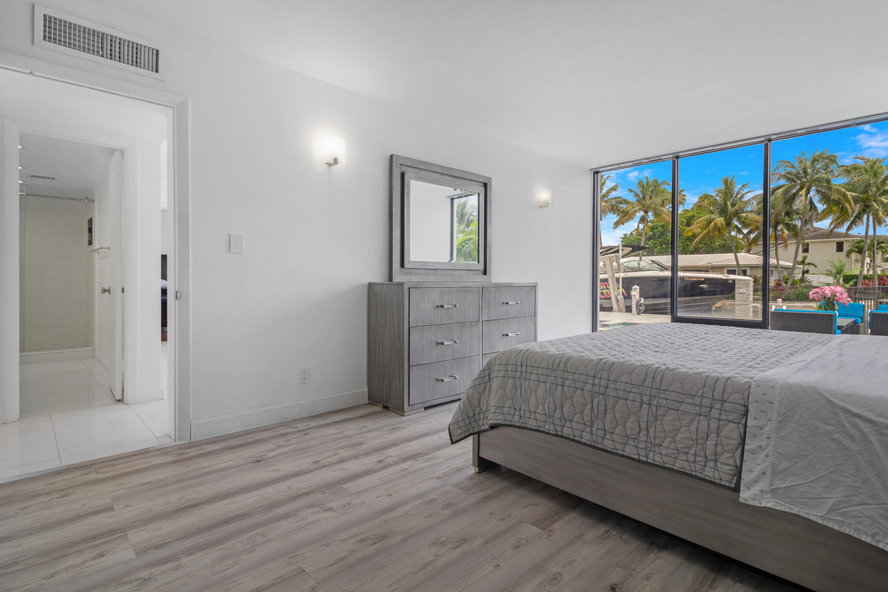 2549 Southeast 9th Street Pompano Beach, FL 33062 - Photo 39 of 73 a spacious bedroom with a bed and a large window