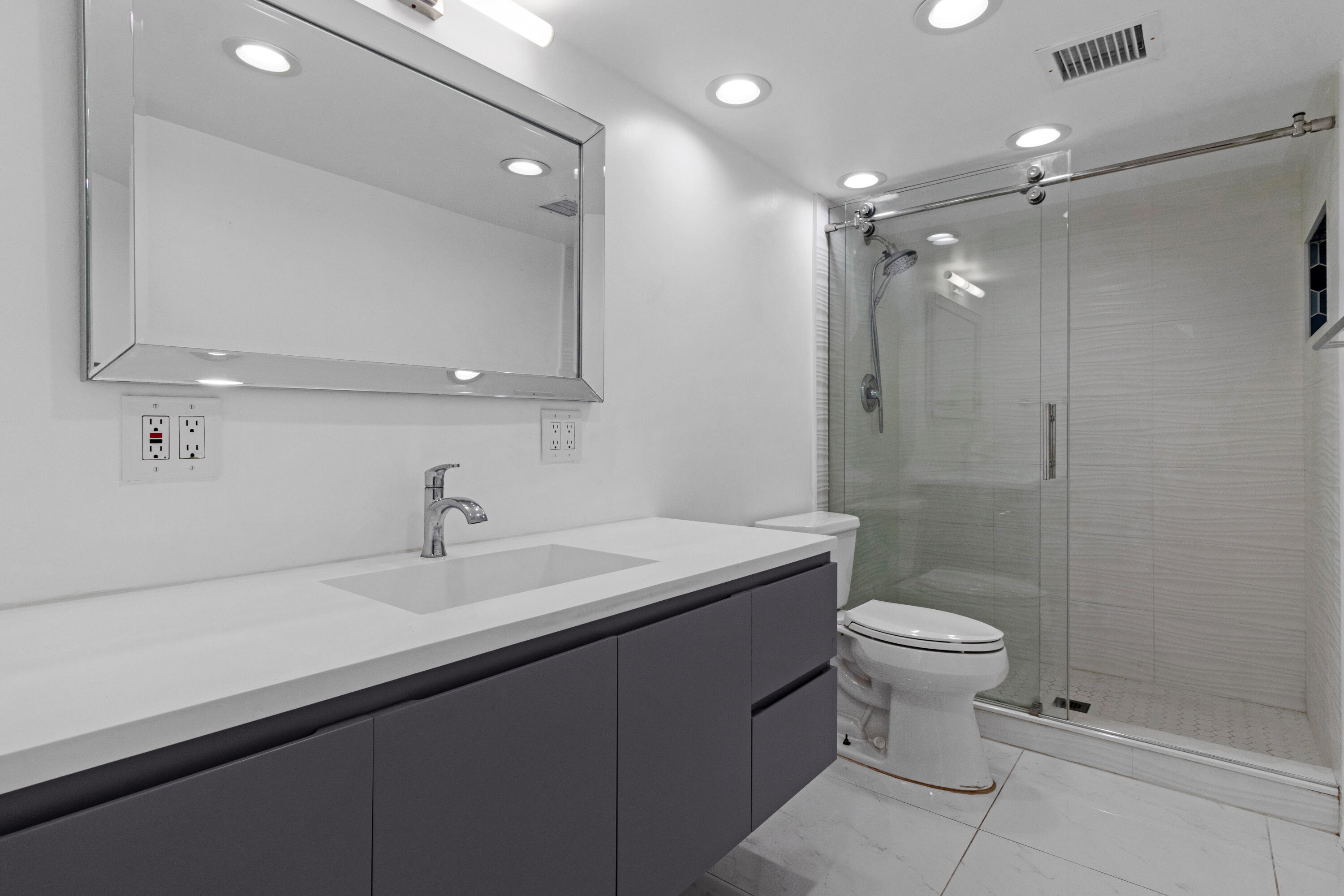 2549 Southeast 9th Street Pompano Beach, FL 33062 - Photo 40 of 73 a bathroom with a sink a toilet and shower