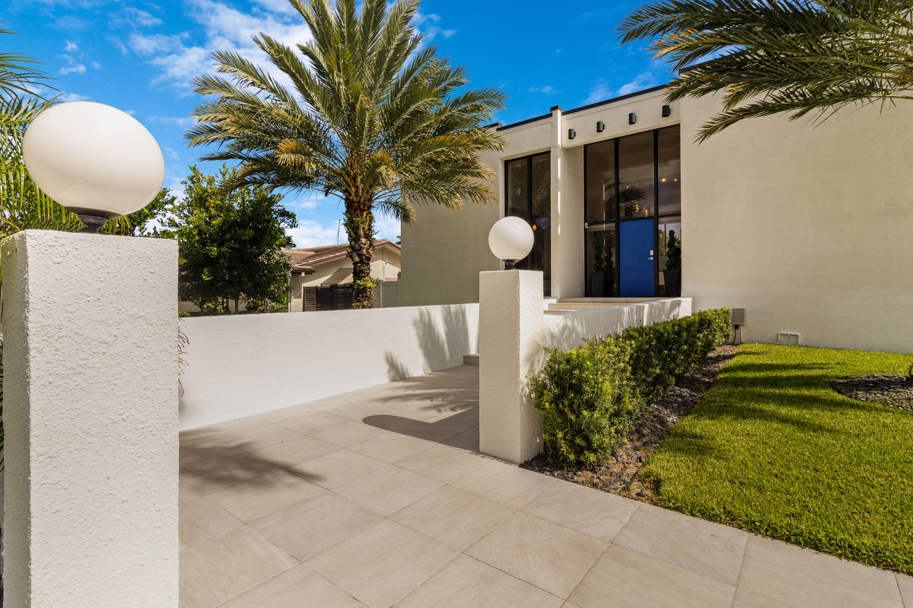 2549 Southeast 9th Street Pompano Beach, FL 33062 - Photo 6 of 73 a front view of a house with garden space and yard