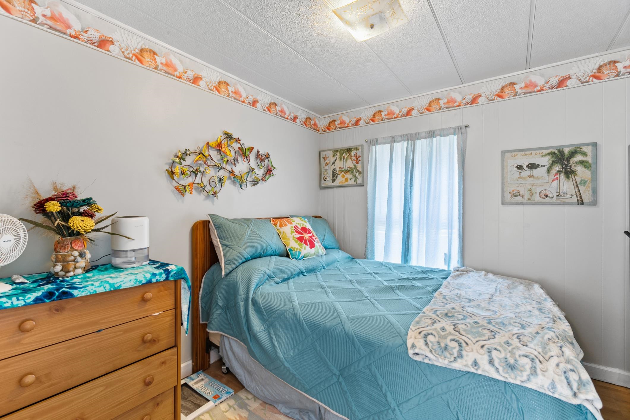 227 Spec Lane Crescent City, FL 32112 - Photo 13 of 24 a bedroom with a bed and a dresser