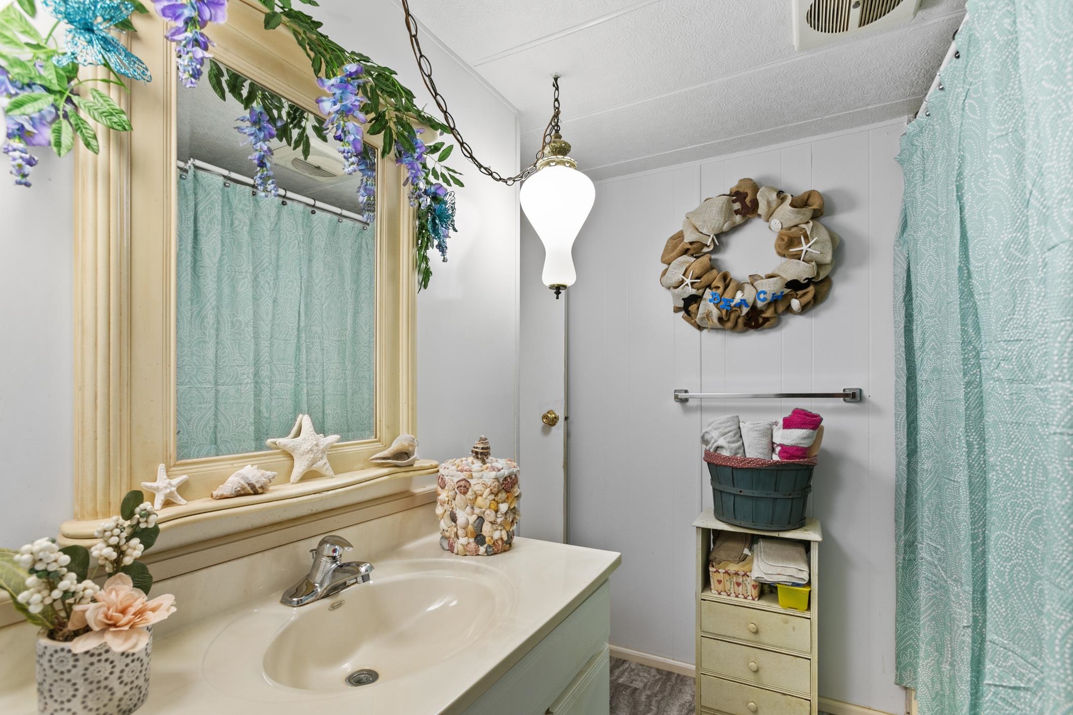 227 Spec Lane Crescent City, FL 32112 - Photo 14 of 24 a bathroom with a sink mirror and vanity