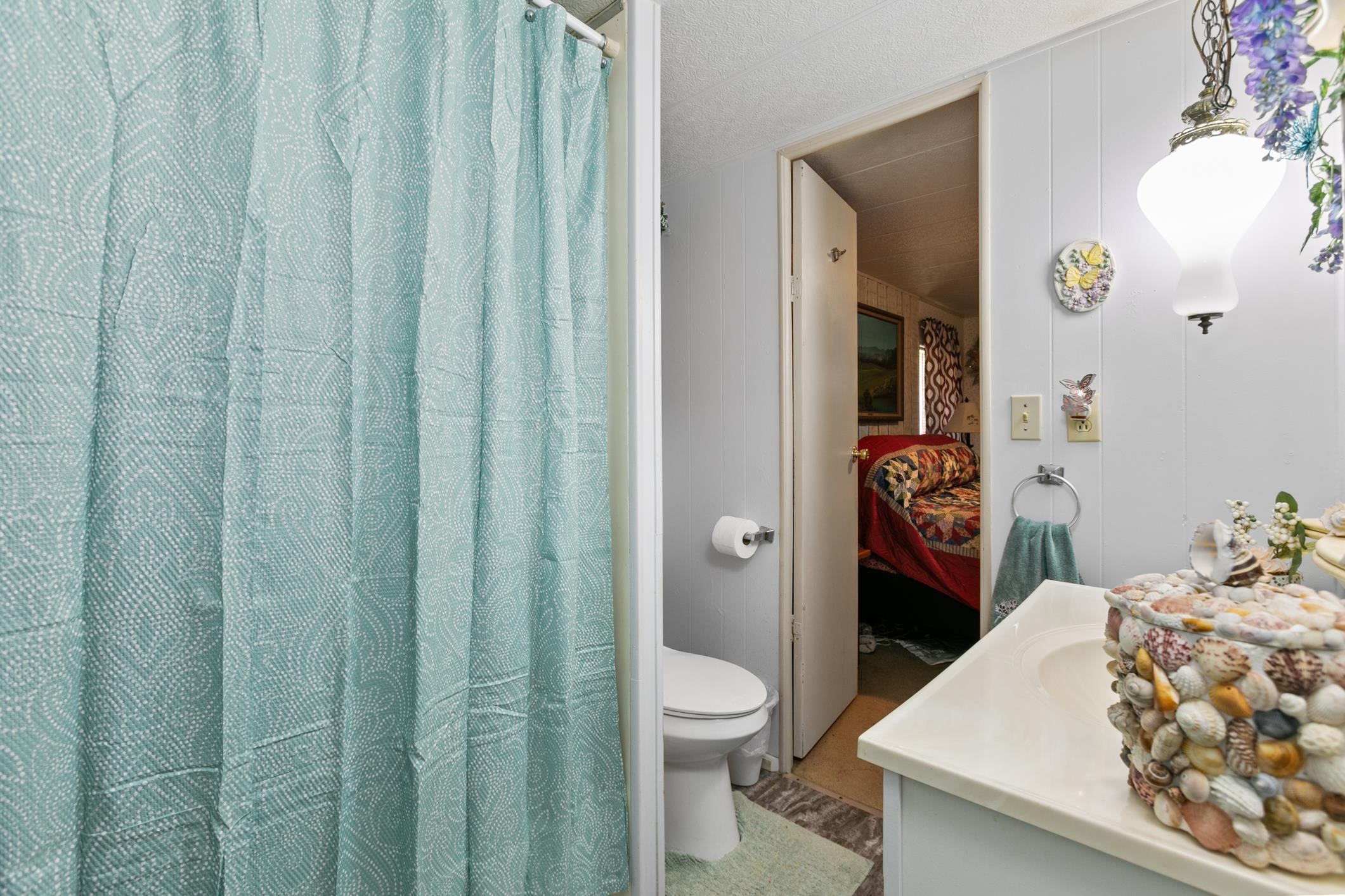 227 Spec Lane Crescent City, FL 32112 - Photo 15 of 24 a bathroom with a sink and toilet