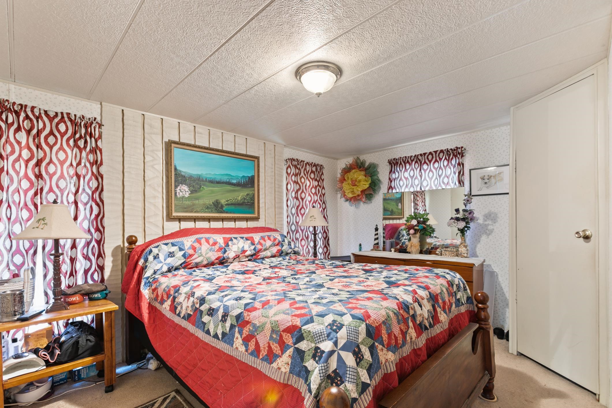 227 Spec Lane Crescent City, FL 32112 - Photo 16 of 24 a bed sitting in a bedroom next to a window
