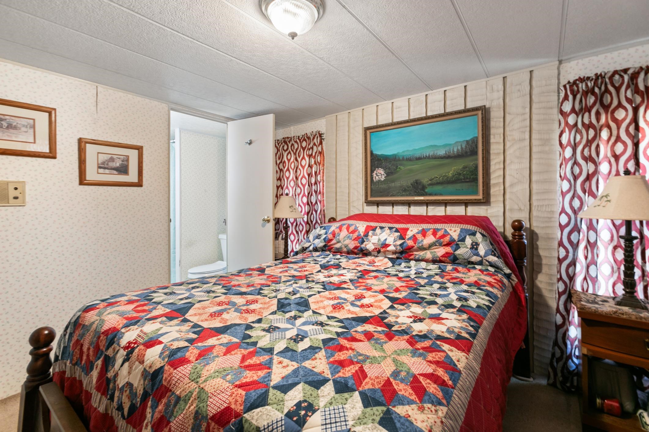 227 Spec Lane Crescent City, FL 32112 - Photo 17 of 24 a bedroom with a bed and a flat screen tv