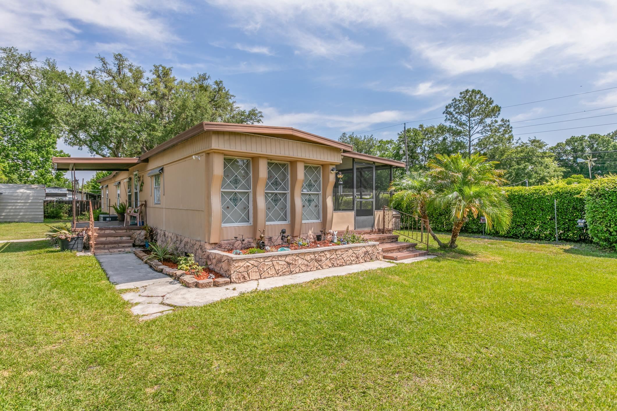 227 Spec Lane Crescent City, FL 32112 - Photo 18 of 24 a view of a house with backyard porch and sitting area