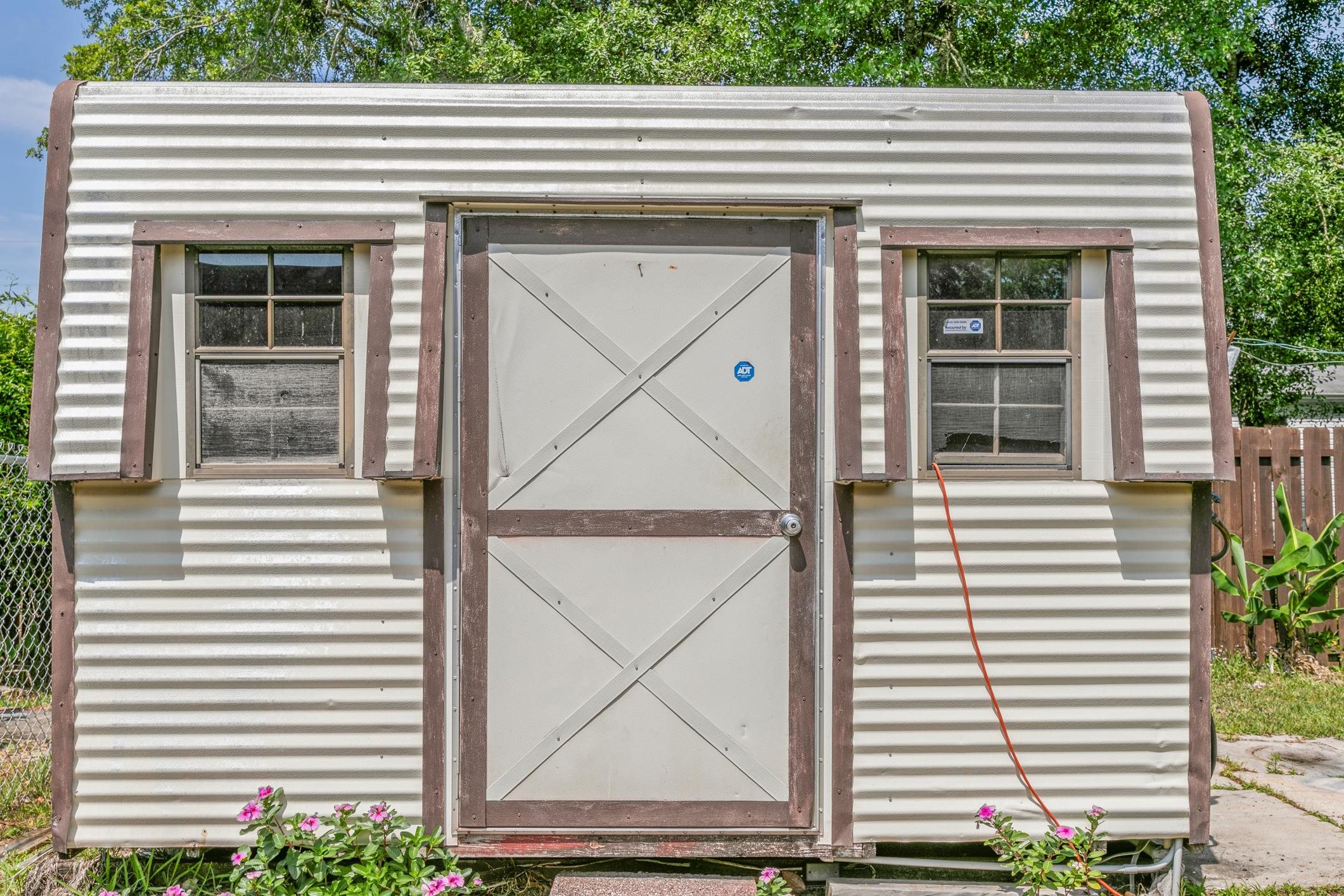 227 Spec Lane Crescent City, FL 32112 - Photo 22 of 24 a view of a house with a door and a window