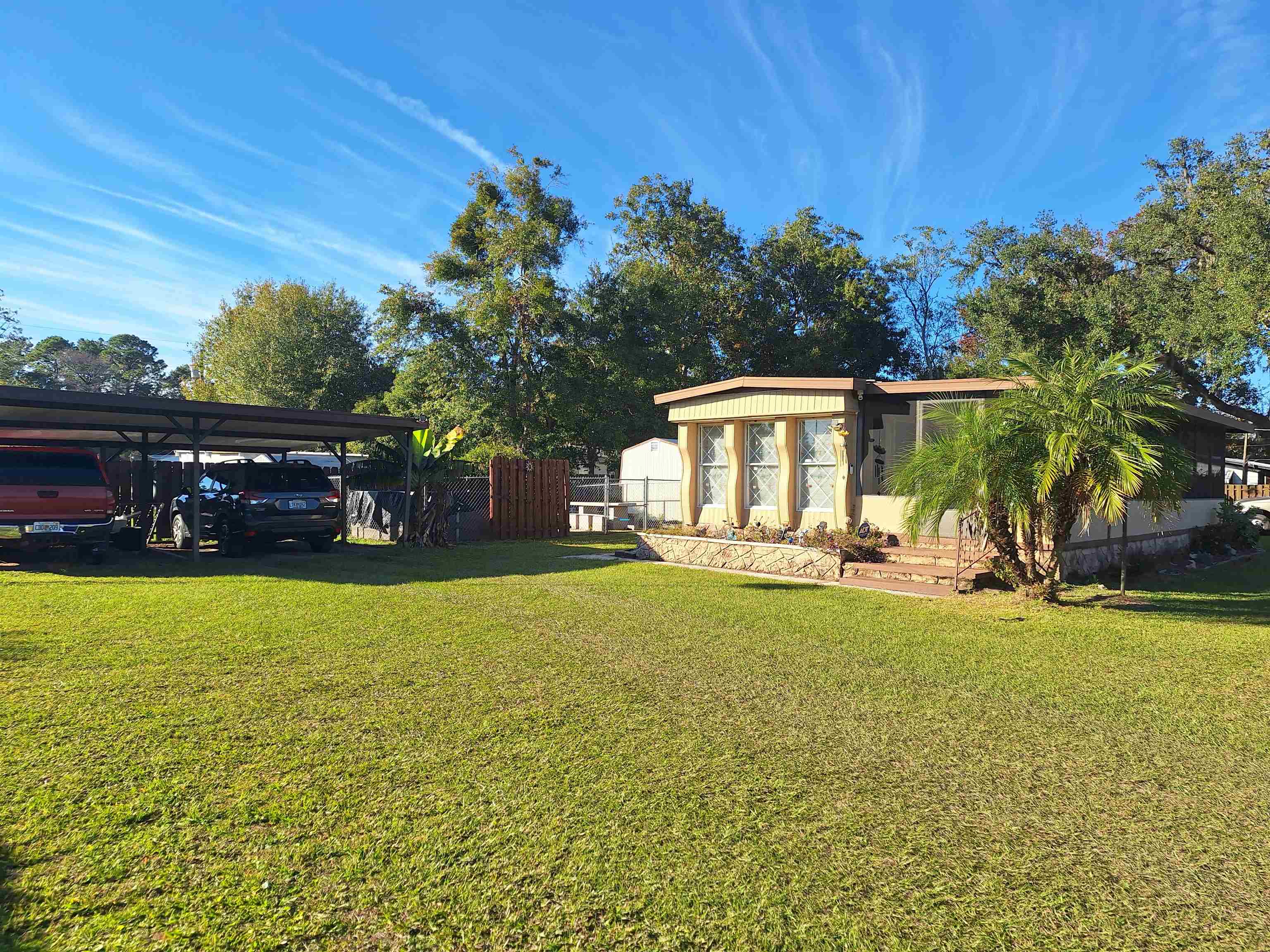 227 Spec Lane Crescent City, FL 32112 - Photo 3 of 24 a view of a house with backyard and sitting area