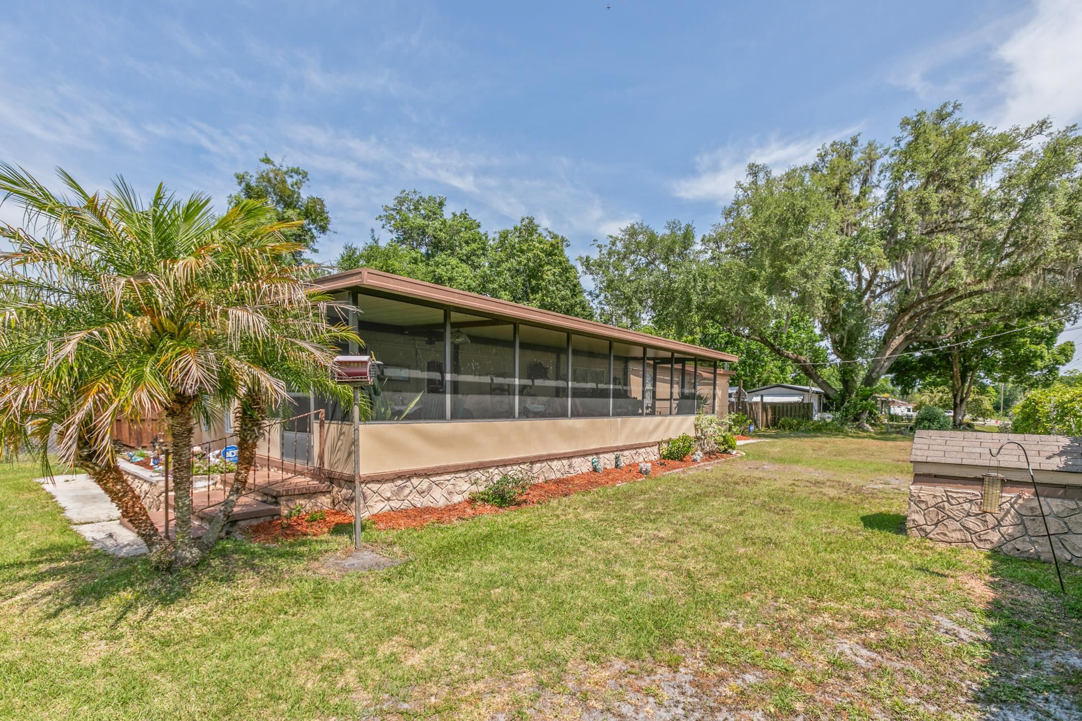 227 Spec Lane Crescent City, FL 32112 - Photo 5 of 24 a view of a house with a yard