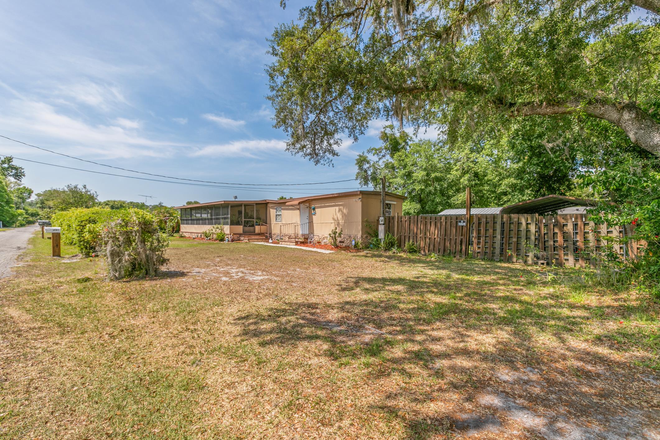 227 Spec Lane Crescent City, FL 32112 - Photo 6 of 24 a view of a yard with wooden fence
