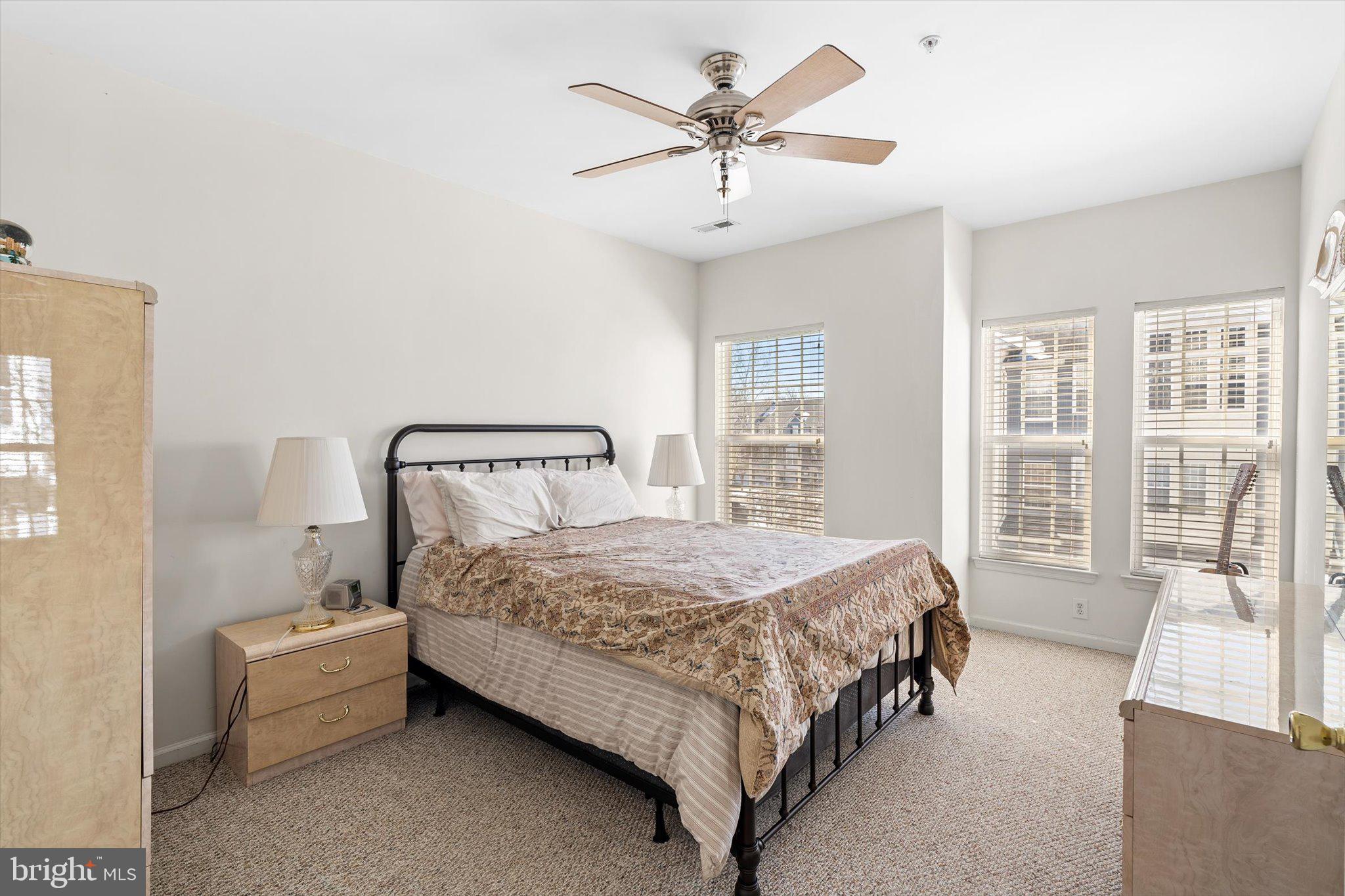 13 River Lane Delanco, NJ 08075 - Photo 13 of 19 a bedroom with a bed a couch and a large window with the outer view
