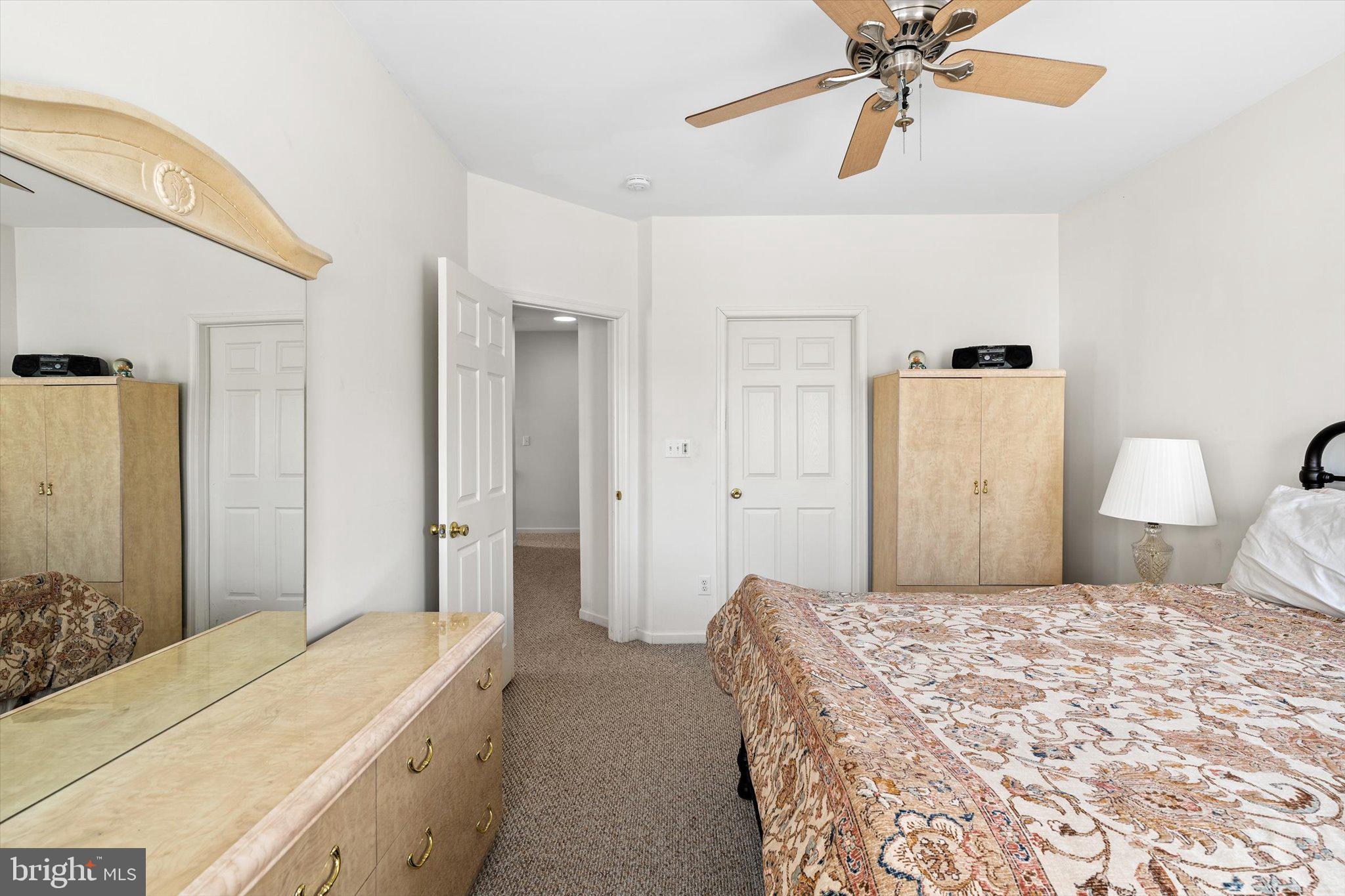 13 River Lane Delanco, NJ 08075 - Photo 15 of 19 a bedroom with a bed and a chandelier