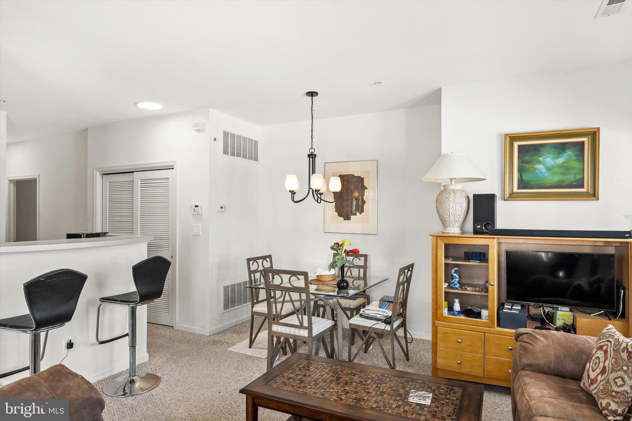 13 River Lane Delanco, NJ 08075 - Photo 5 of 19 a living room with furniture and a flat screen tv