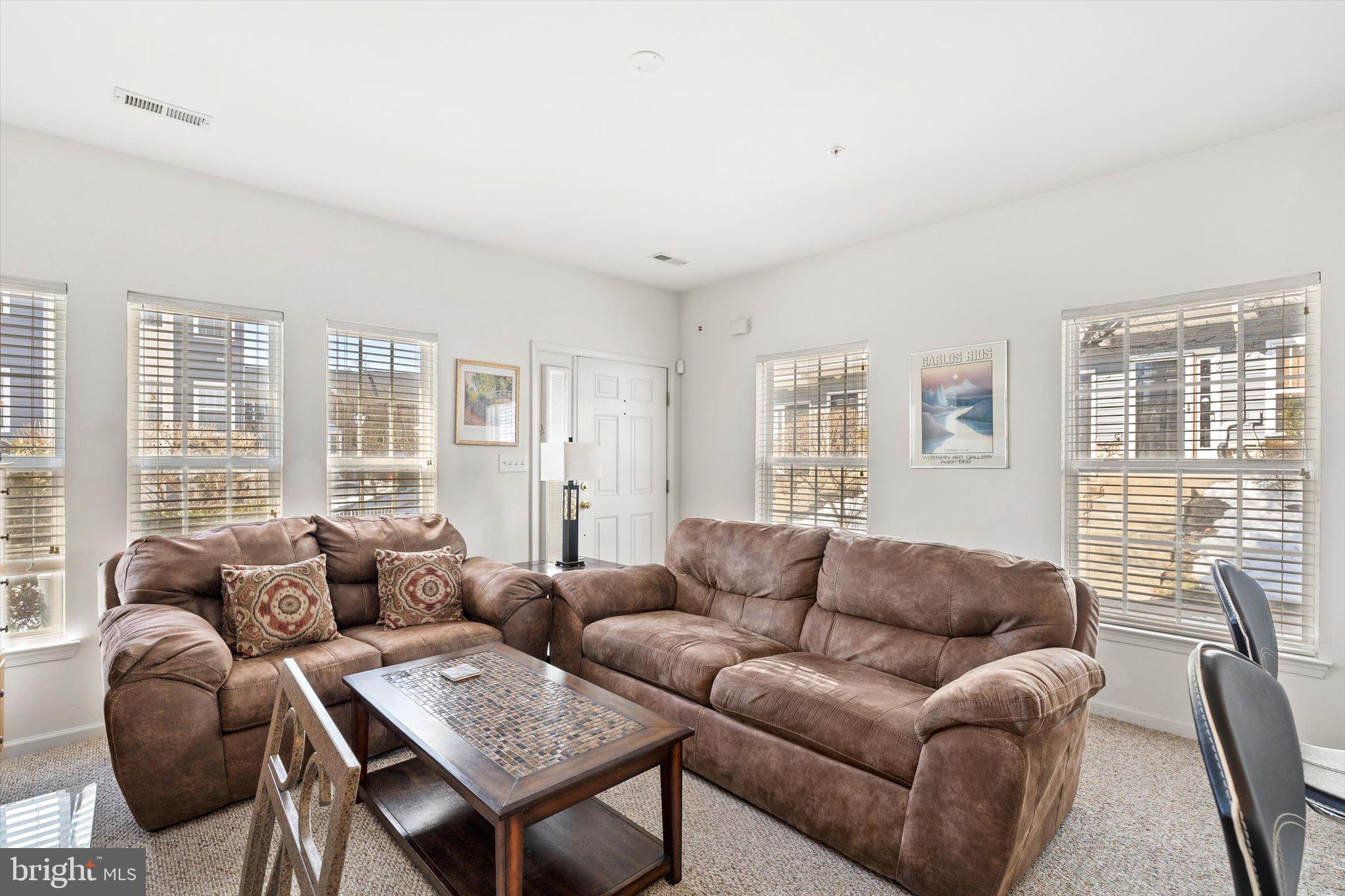 13 River Lane Delanco, NJ 08075 - Photo 7 of 19 a living room with furniture a large window and a wooden floor