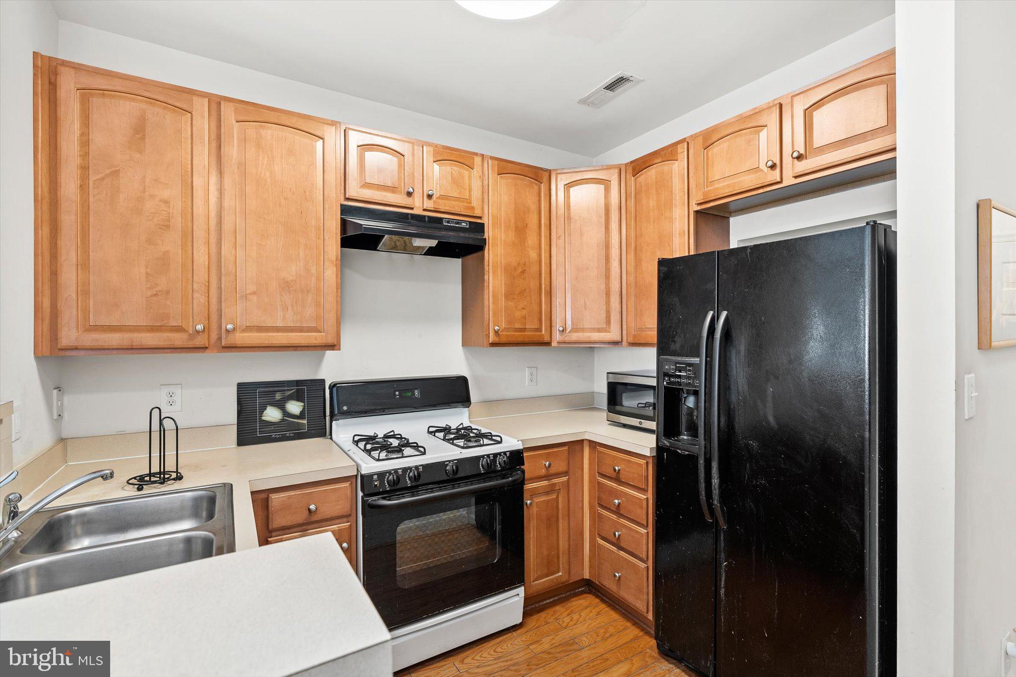 13 River Lane Delanco, NJ 08075 - Photo 9 of 19 a kitchen with stainless steel appliances granite countertop a refrigerator stove and sink